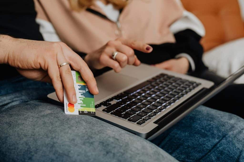 A man and woman checking savings