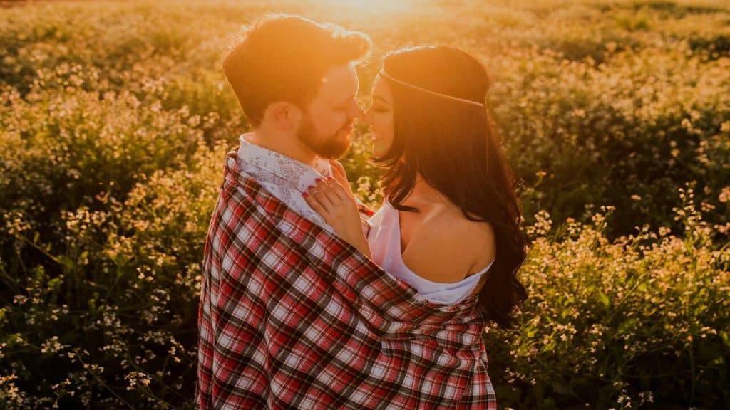 A couple kissing at sunset