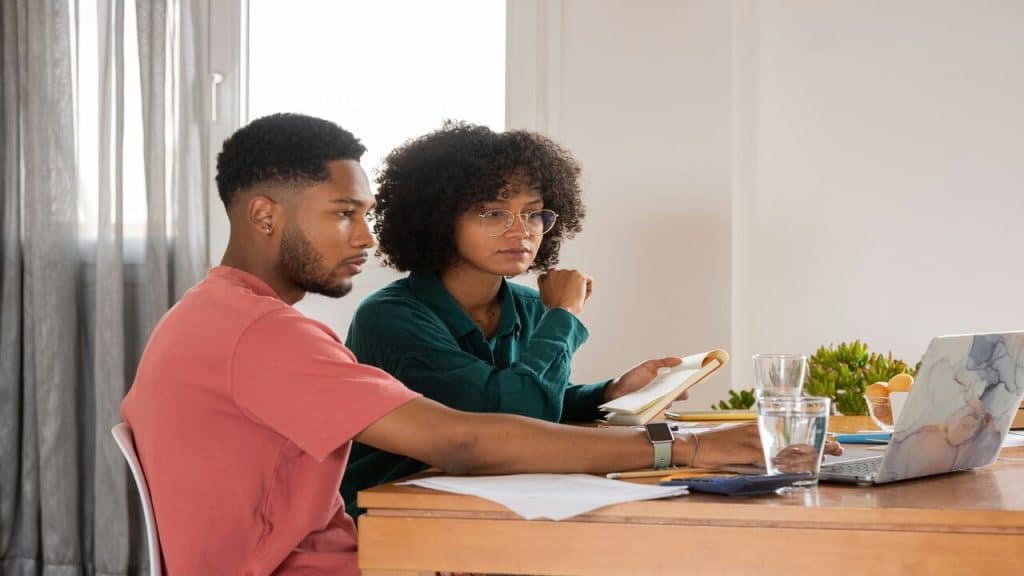 A couple looking at a laptop