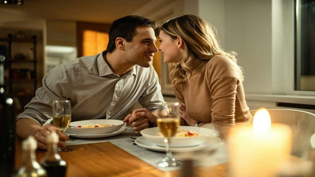 A couple looking at each other during dinner