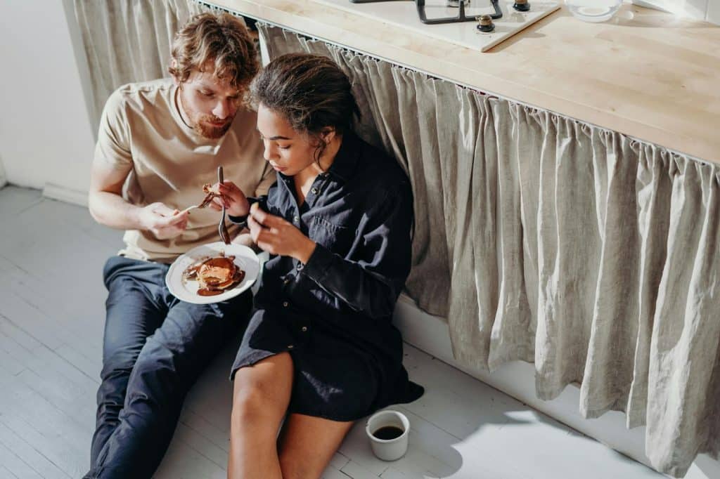 A man and woman eating