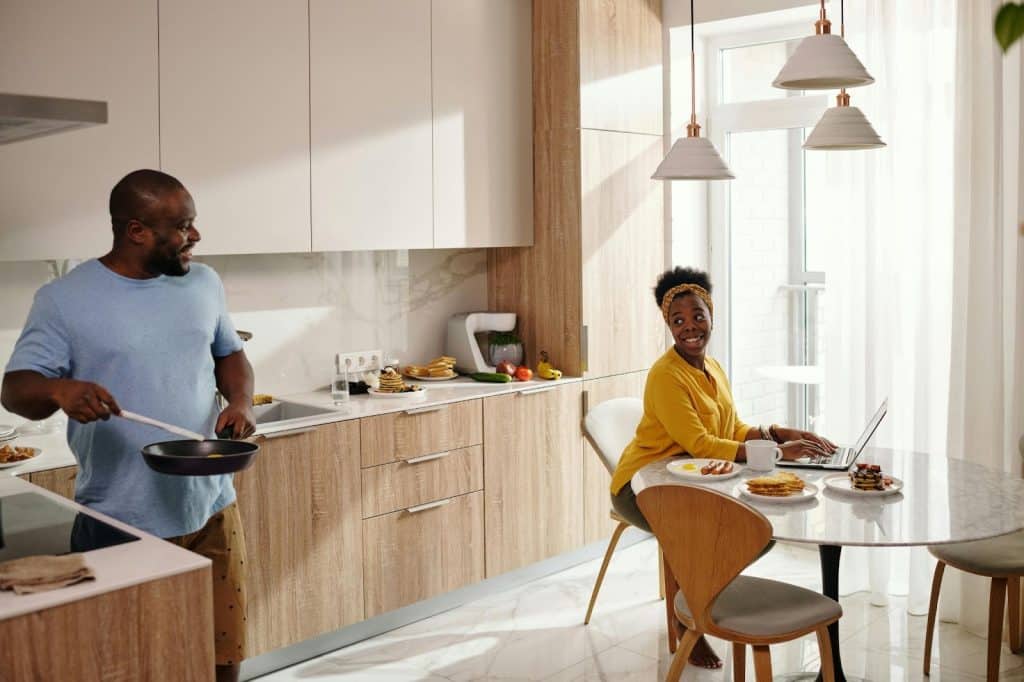A man cooking for woman