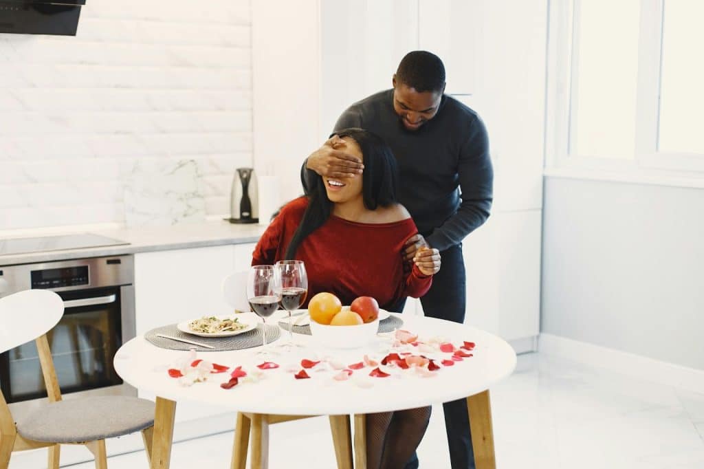 A man surprising a woman