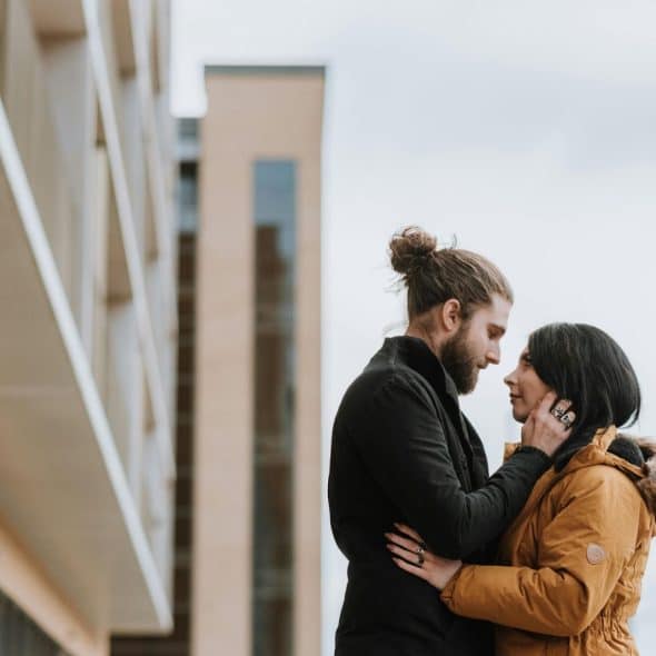 A man and woman facing each other