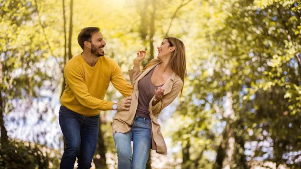 Couple strolling slowly through a park