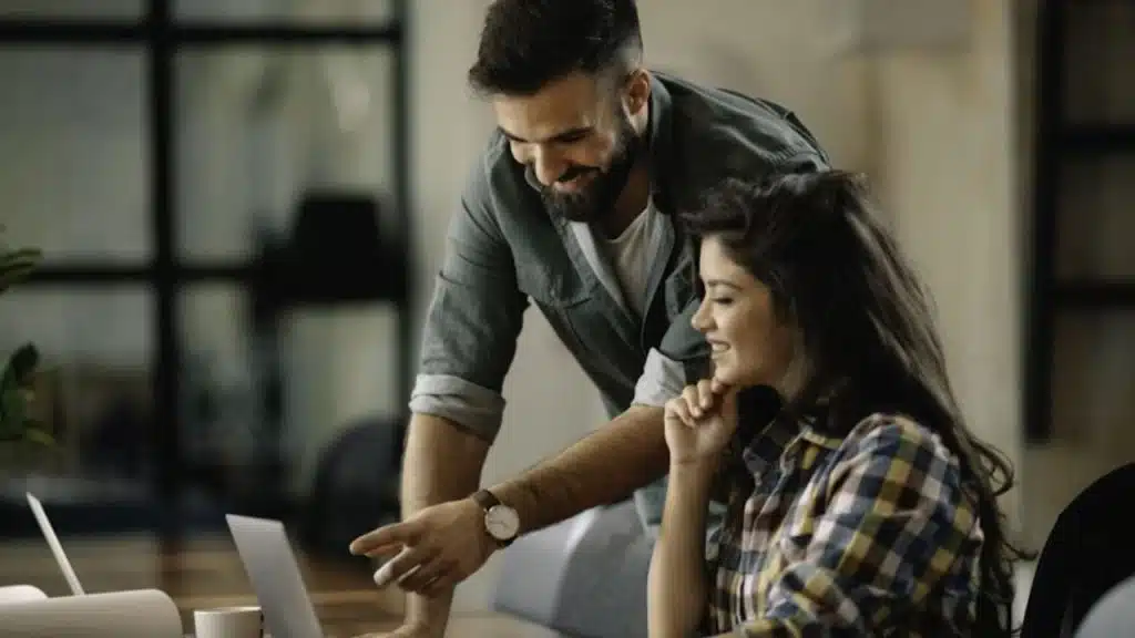 Woman recalling a detail while smiling at a man