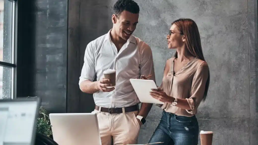 Woman complimenting a man’s style with a smile
