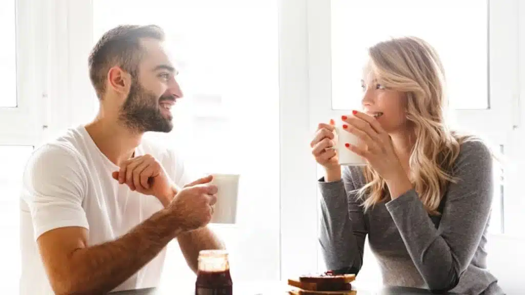 Woman listening intently to a man with no phone in sight