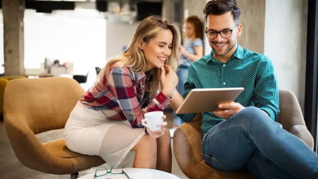 Woman smiling while talking about shared hobbies with a man
