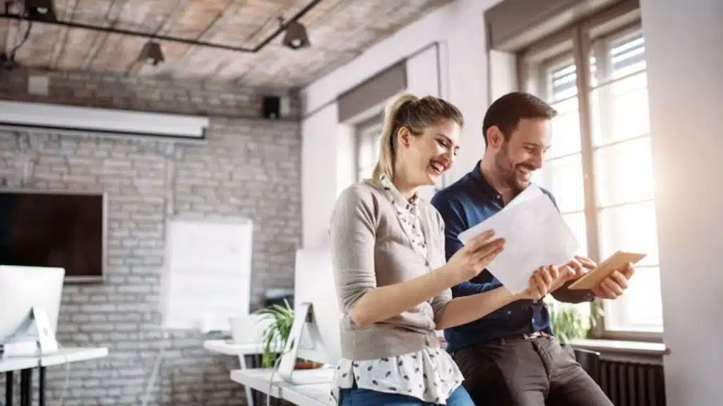 Woman smiling while extending a conversation with a man