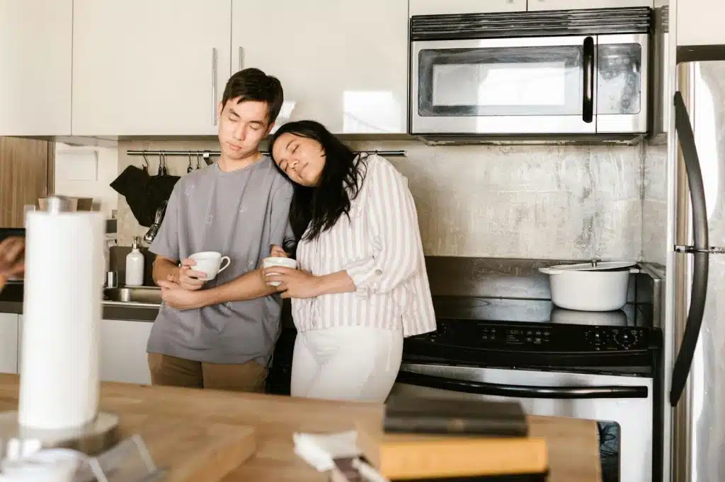 A man and woman at the kitchen