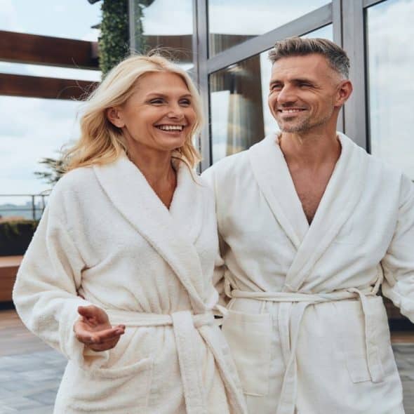 A beautiful mature couple wearing bathrooms.