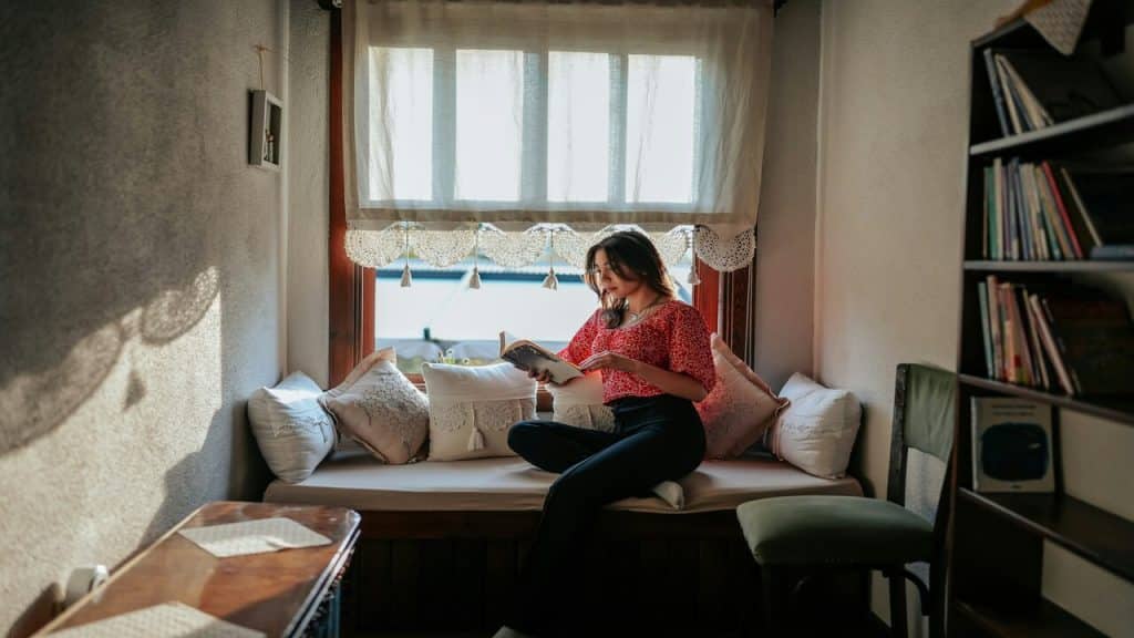 A woman reading alone by herself