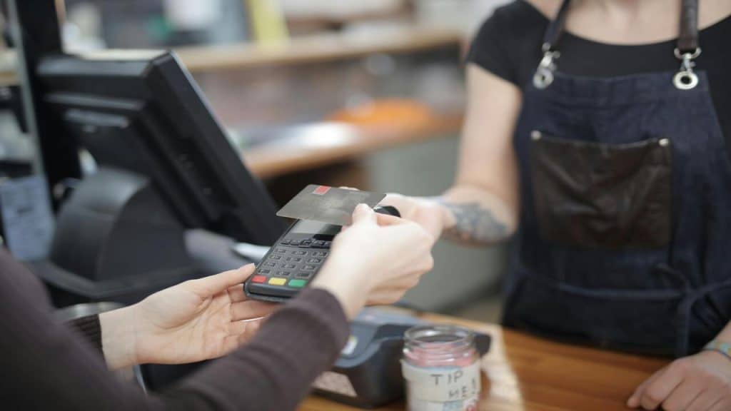 A woman paying for the bill