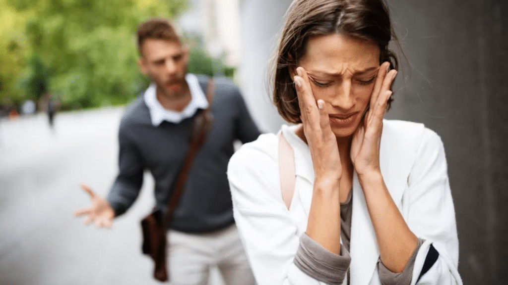 Woman appearing upset while the man is unaware of her feelings