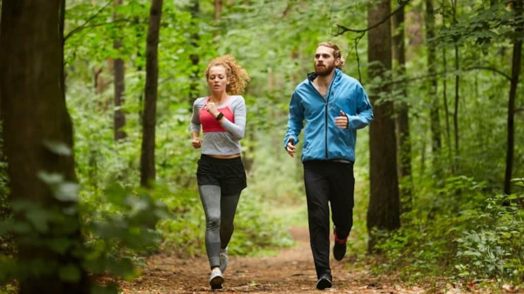 Couple jogging together on a trail