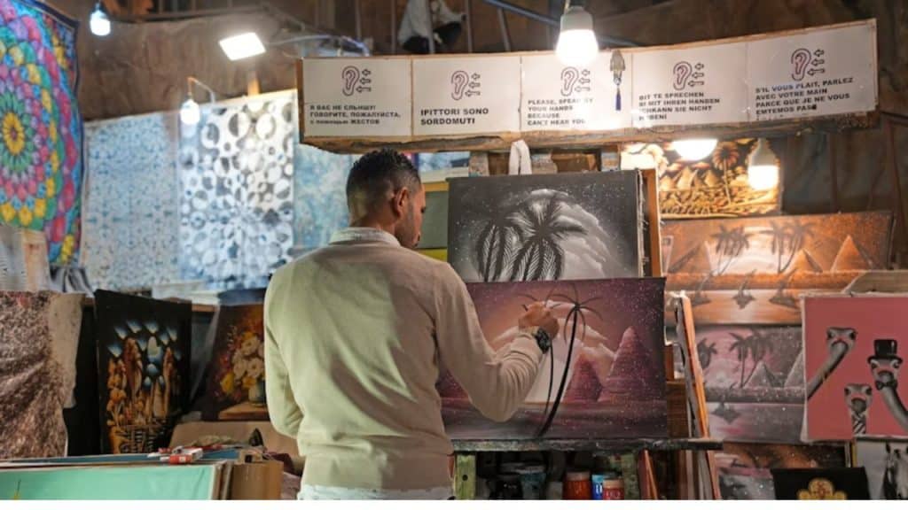 Man painting in a small home studio