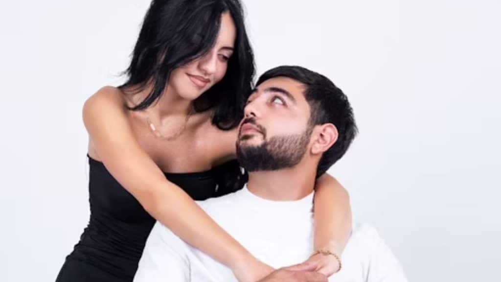 Man feeling down while his partner comforts him