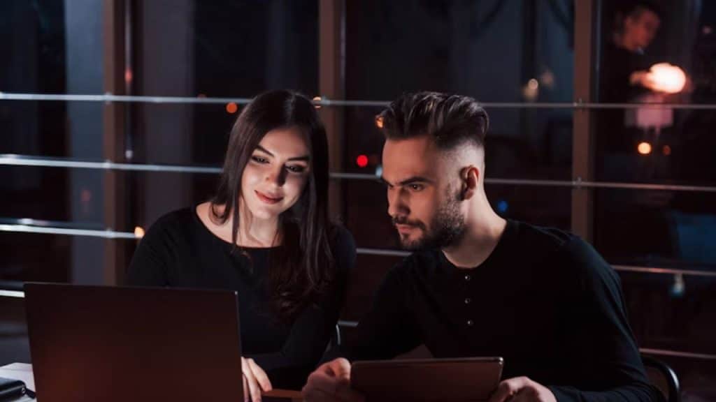 Couple reviewing their budget on a laptop together