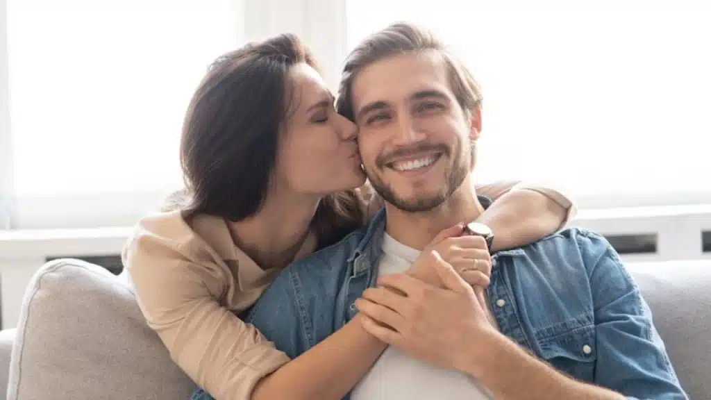 Wife hugging her husband and thanking him for being supportive