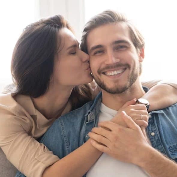 Wife hugging her husband and thanking him for being supportive