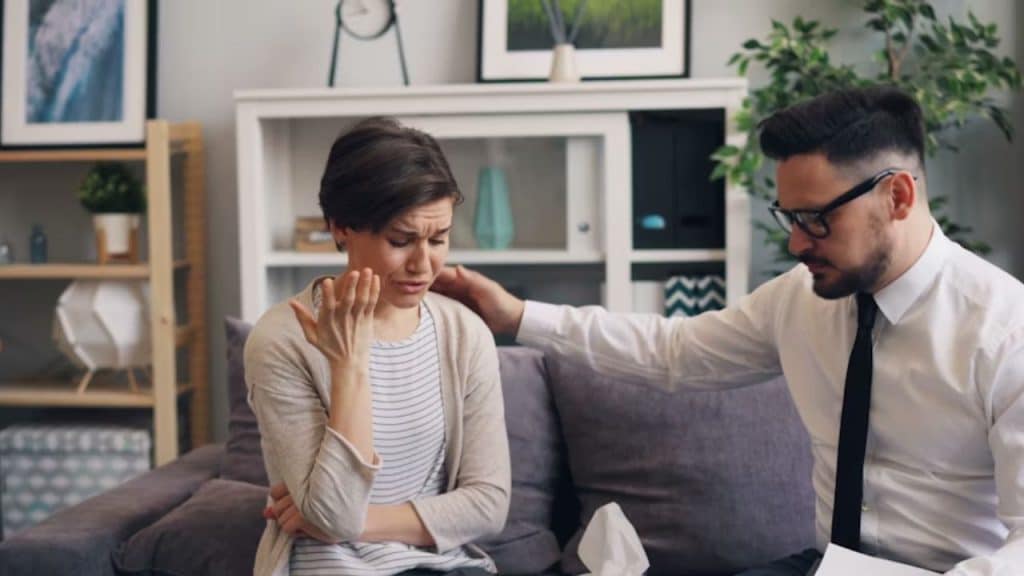 Calm husband talking through a stressful situation with his wife