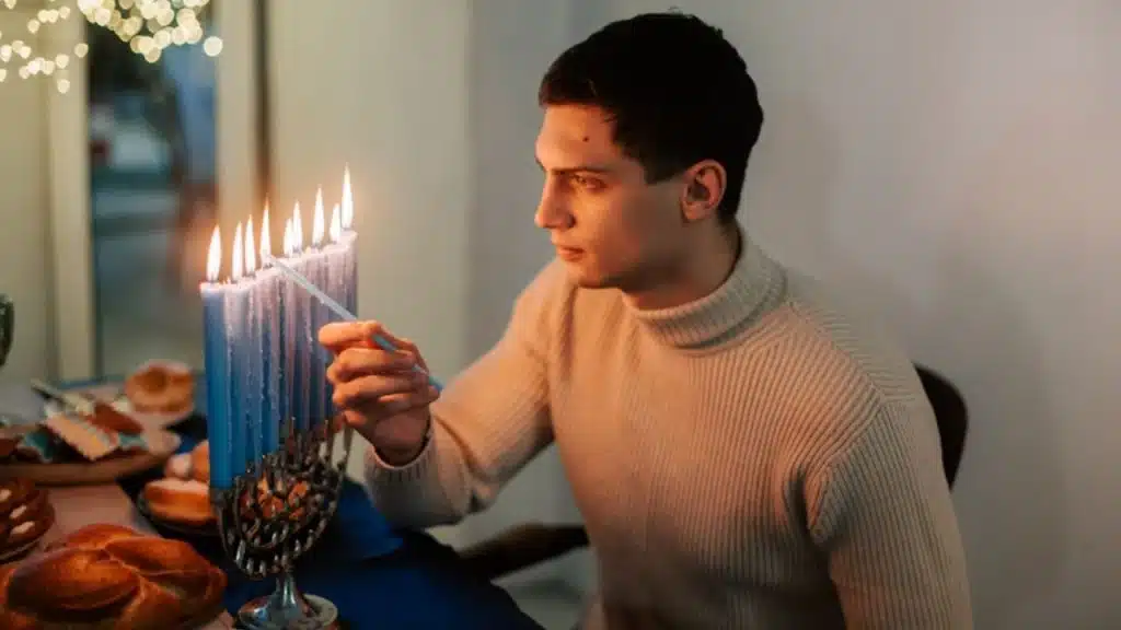Husband lighting candles for a romantic dinner
