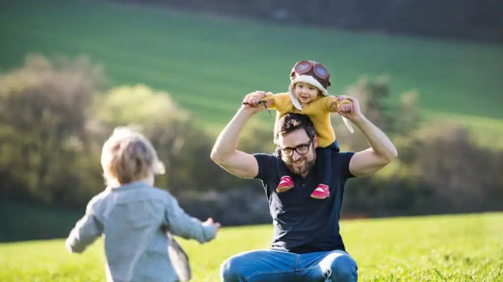 Husband playing with kids after work