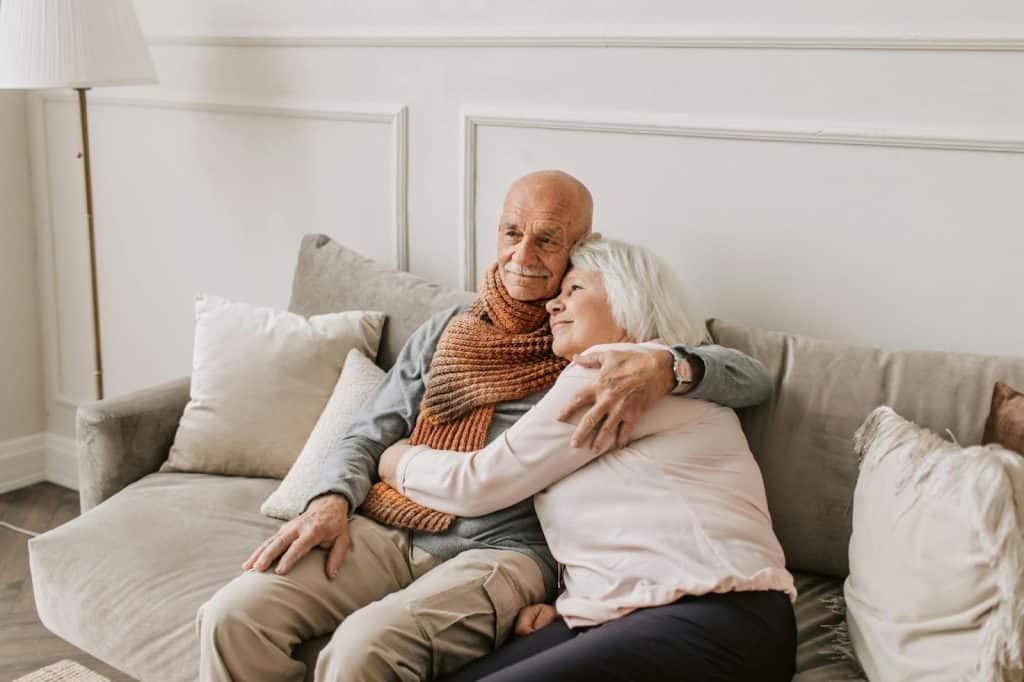 A man and woman hugging each other