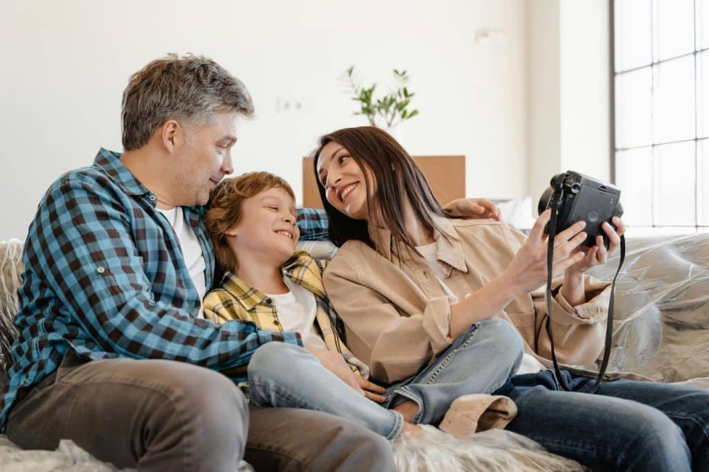 A man and woman bonding with a kid 