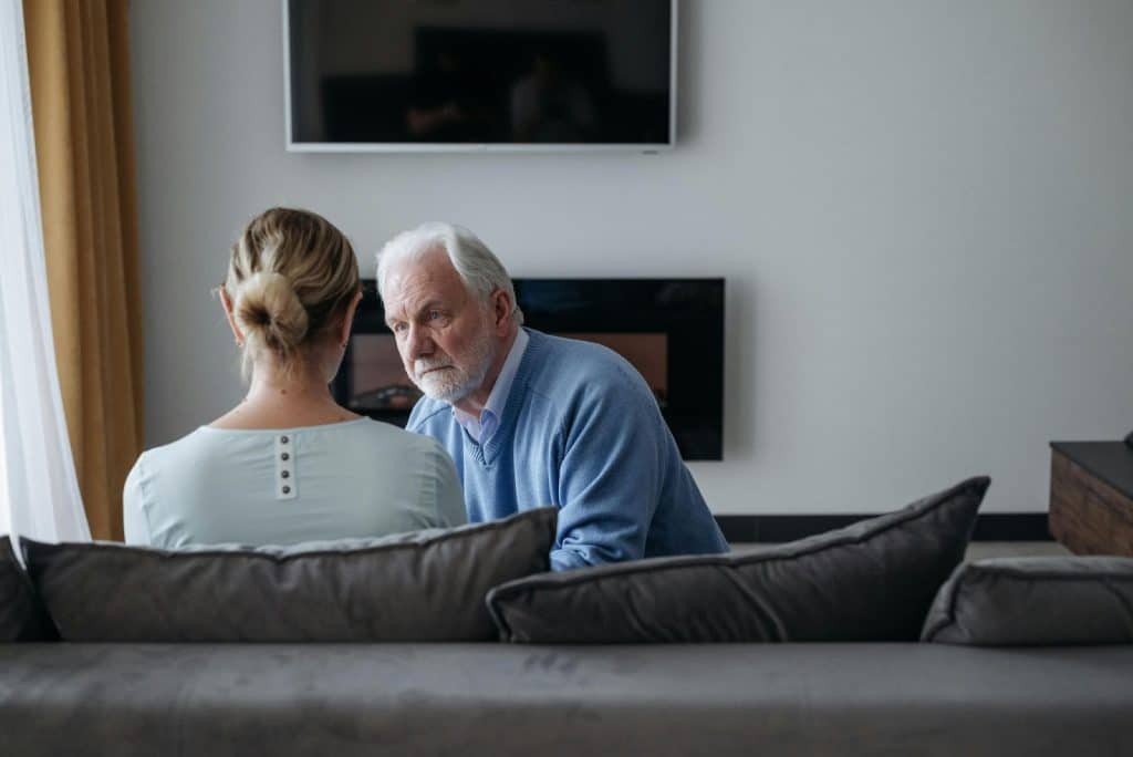 A man and woman having a serious discussion