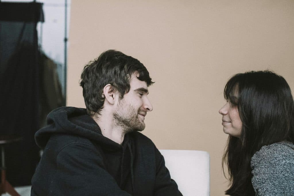 A man and woman looking at each other