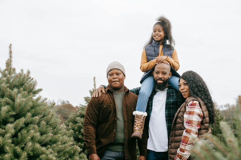 A man and woman living happy with their children