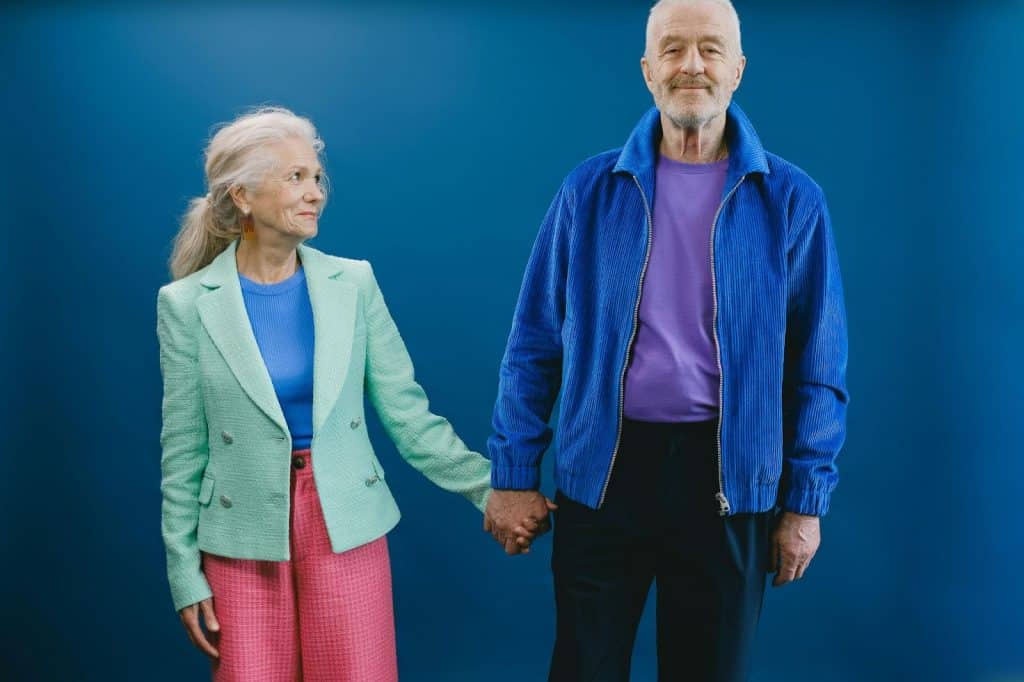 A man and woman holding hands