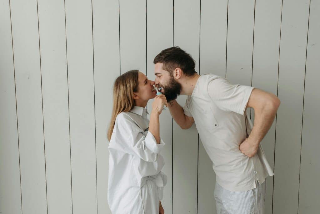 A man and woman facing each other