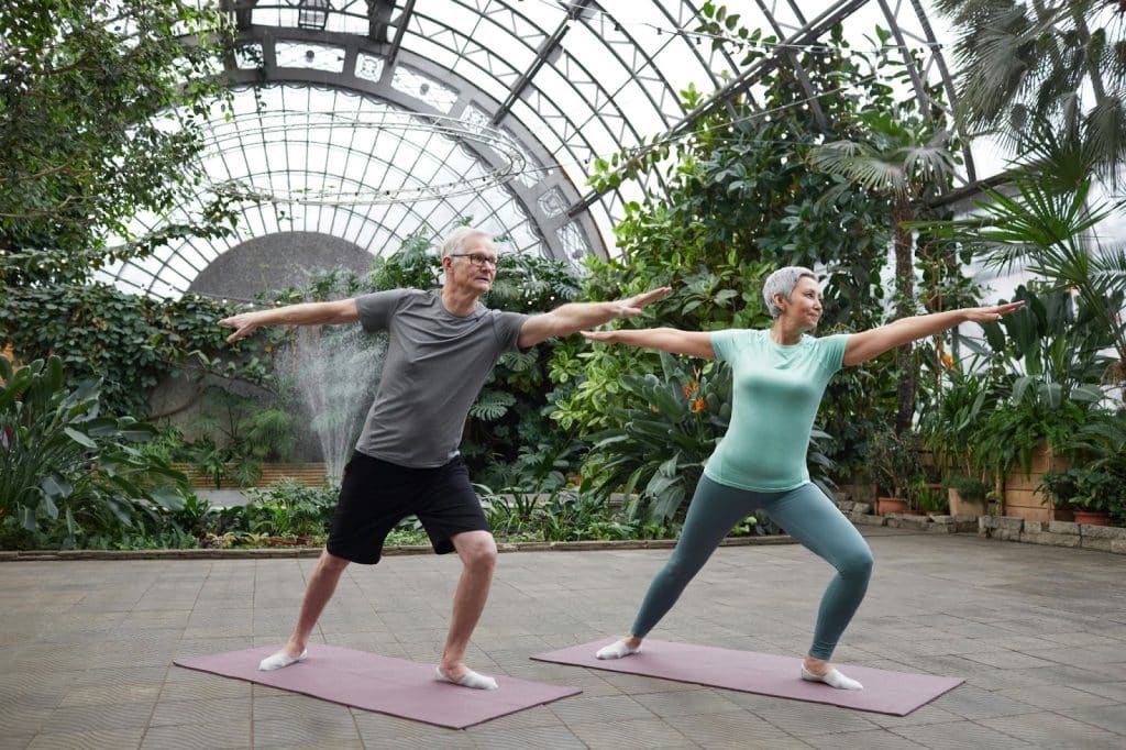 A man and woman doing yoga