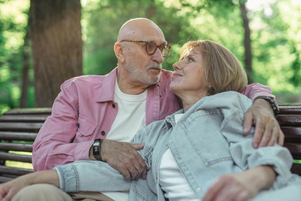 A man and woman sitting and looking at each other