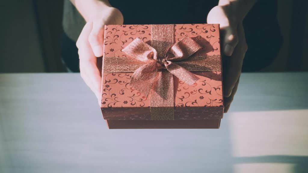 A person offering a gift