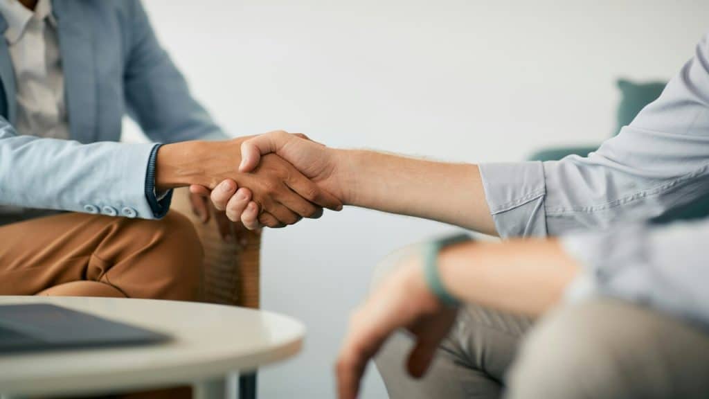 Two people shaking hands.
