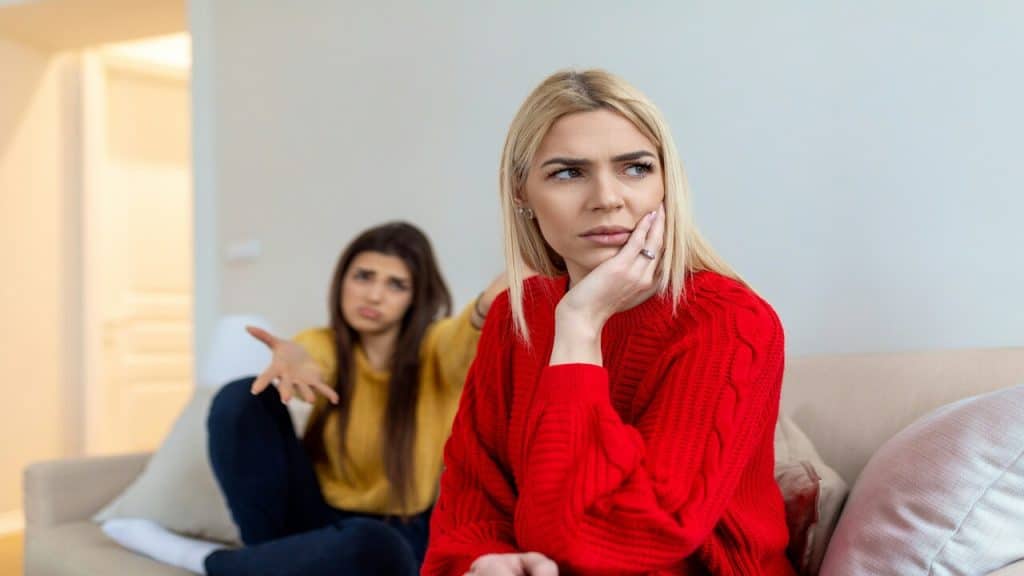 A woman ignoring her friend.