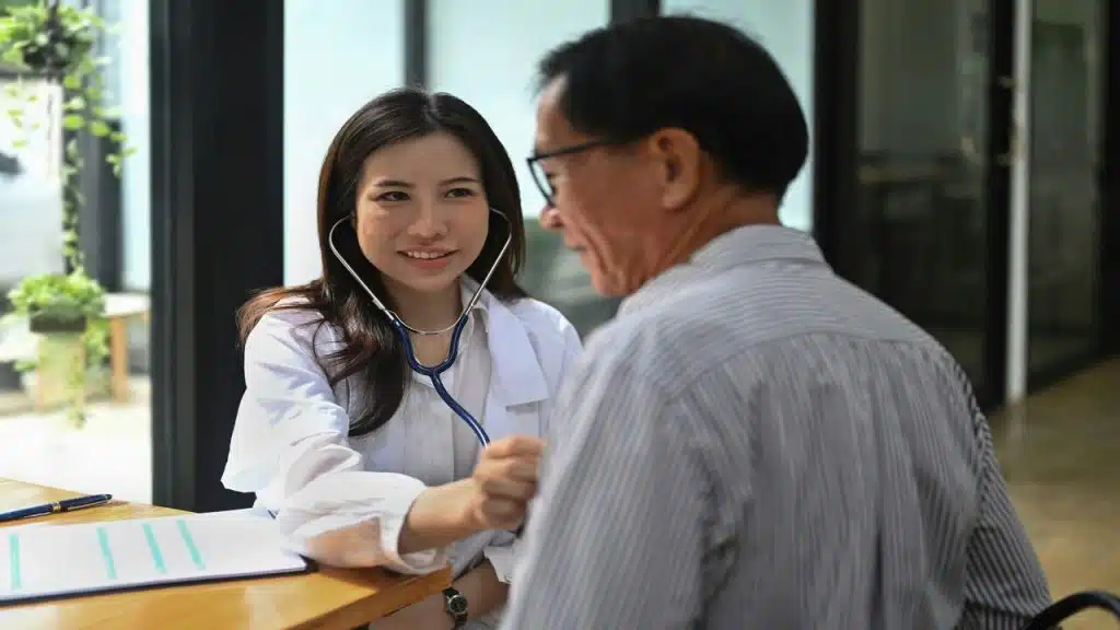 A doctor checking on a patient.