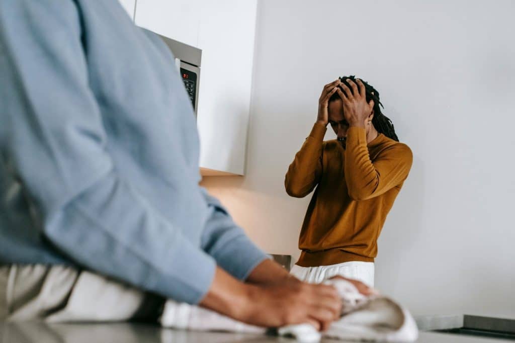 A man holding his head