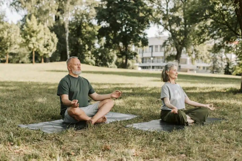 A man and woman doing yoga together