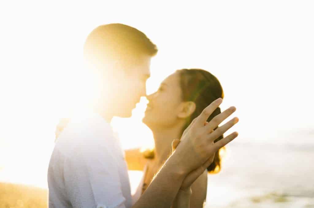 A man and woman facing each other