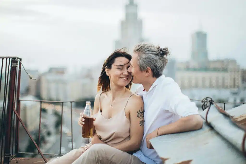 A man kissing a woman’s cheek