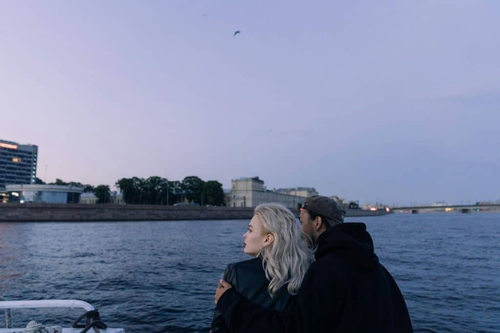 A man and woman looking at the sea