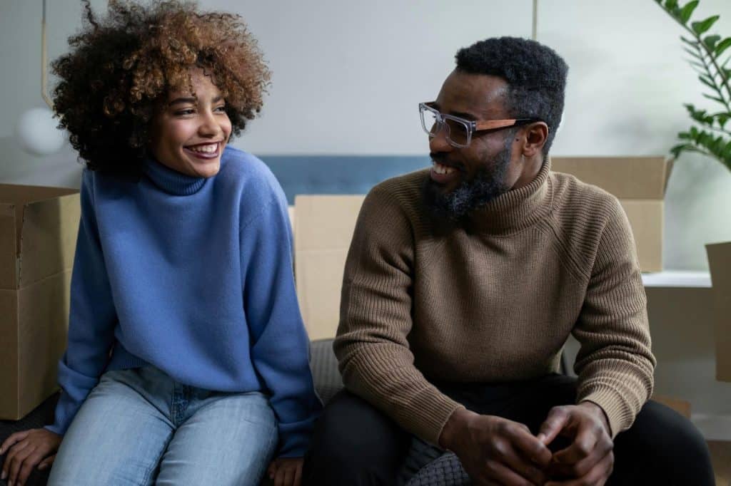A man and woman smiling at each other