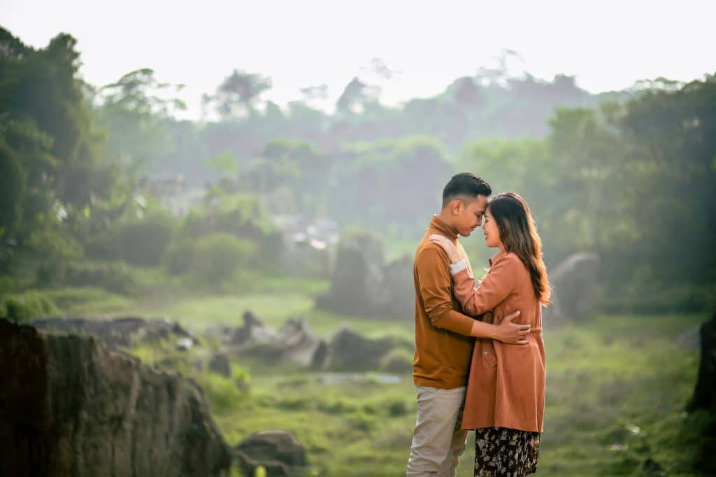 A man and woman facing each other