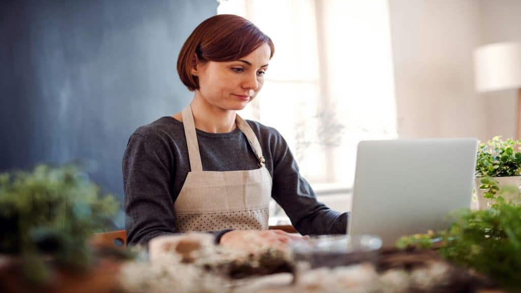 A woman looking sad while working