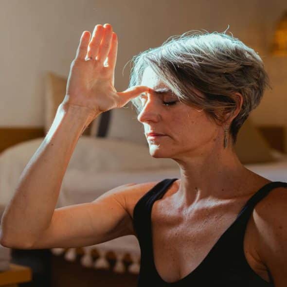 A mature woman meditating